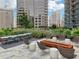 Outdoor seating area featuring comfortable seating, a fire pit, and city views at 1080 Peachtree Ne St # 2416, Atlanta, GA 30309