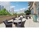 Outdoor patio with comfortable seating and lush greenery, offering a relaxing space to enjoy city views at 1080 Peachtree Ne St # 2416, Atlanta, GA 30309