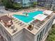 An aerial view of the rooftop pool with lounge chairs and views of the city at 1080 Peachtree Ne St # 2416, Atlanta, GA 30309