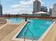 Rooftop pool deck with lounge chairs, umbrellas, and city views at 1080 Peachtree Ne St # 2416, Atlanta, GA 30309