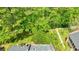 An aerial view highlighting the lush greenery and peaceful surroundings near the buildings at 12 Valley Forge Nw Pl # 215, Atlanta, GA 30318