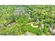 Aerial view of a baseball field, tennis courts, and residential area, surrounded by dense trees at 12 Valley Forge Nw Pl # 215, Atlanta, GA 30318