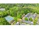 An aerial perspective highlighting the community's tennis courts, playground, and residential buildings at 12 Valley Forge Nw Pl # 215, Atlanta, GA 30318