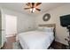 Cozy bedroom features a ceiling fan, closet and natural light at 12 Valley Forge Nw Pl # 215, Atlanta, GA 30318