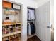 Organized closet with shelving for shoes and accessories, plus hanging space for clothes at 12 Valley Forge Nw Pl # 215, Atlanta, GA 30318