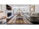 Bright living room with a fireplace, large windows, and comfortable seating arrangement at 12 Valley Forge Nw Pl # 215, Atlanta, GA 30318