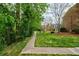 A serene walking path lined with lush greenery and trees for relaxing strolls within the community at 12 Valley Forge Nw Pl # 215, Atlanta, GA 30318