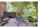 Outdoor patio space perfect for entertaining with furniture and a grill at 12 Valley Forge Nw Pl # 215, Atlanta, GA 30318