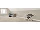 Attic room featuring carpeted floors, a window with shutters, and a comfortable sofa with decorative pillows at 222 Rippling Nw Dr, Marietta, GA 30064