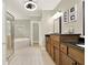Bright bathroom featuring dual vanities, granite countertops, and a separate tub and glass-enclosed shower at 222 Rippling Nw Dr, Marietta, GA 30064