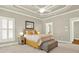 Comfortable bedroom features a decorative ceiling, a shuttered window, and cozy furniture for a relaxing space at 222 Rippling Nw Dr, Marietta, GA 30064