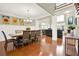 Dining room with hardwood floors, seating for eight, and an open view to the living room at 222 Rippling Nw Dr, Marietta, GA 30064