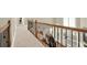 Upstairs hallway with hardwood railing overlooking the living area below, providing an open feel at 222 Rippling Nw Dr, Marietta, GA 30064