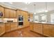 Bright kitchen features modern stainless steel appliances, granite countertops, hardwood floors and ample cabinet space at 222 Rippling Nw Dr, Marietta, GA 30064