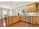 The bright kitchen features stainless steel appliances, granite countertops, ample counter space, and wood cabinets at 222 Rippling Nw Dr, Marietta, GA 30064