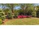 Beautiful lawn with azaleas lining the wrought iron fence at 222 Rippling Nw Dr, Marietta, GA 30064