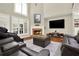 Bright living room with fireplace, plush seating, and modern entertainment center for comfortable relaxation at 222 Rippling Nw Dr, Marietta, GA 30064