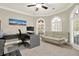 Bright home office featuring a modern desk, comfortable seating, and plenty of natural light from large windows at 222 Rippling Nw Dr, Marietta, GA 30064