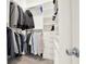 Walk-in closet features ample shelving and hanging space for organization at 222 Rippling Nw Dr, Marietta, GA 30064