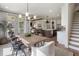 Spacious open-concept layout with a dining room connecting the kitchen and living spaces for easy entertaining at 5345 Keepsake Court, Cumming, GA 30040