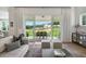 A stylish living room with sliding glass doors leading to a covered patio at 5345 Keepsake Court, Cumming, GA 30040