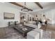 Open-concept living room flows into the kitchen and features a neutral color palette at 5345 Keepsake Court, Cumming, GA 30040