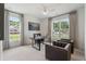 Bright office space with a modern desk and chairs and two large windows at 5345 Keepsake Court, Cumming, GA 30040