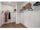 Walk-in closet has wire shelves and hanging racks at 5345 Keepsake Court, Cumming, GA 30040