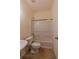 Bathroom featuring a standard toilet, bathtub, and tiled floor at 743 Pecan Knoll Dr # 5, Marietta, GA 30008