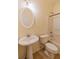 Bathroom with pedestal sink, oval mirror, and a standard toilet and shower/tub combo at 743 Pecan Knoll Dr # 5, Marietta, GA 30008