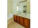 Spacious bathroom featuring tile floors, a dual sink vanity and soaking tub at 743 Pecan Knoll Dr # 5, Marietta, GA 30008