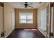 Bedroom featuring hardwood floors, fan and large windows with natural lighting at 743 Pecan Knoll Dr # 5, Marietta, GA 30008