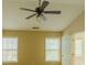 Bright bedroom with vaulted ceiling features a ceiling fan and two windows at 743 Pecan Knoll Dr # 5, Marietta, GA 30008