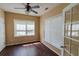 Bedroom featuring hardwood floors, fan and large windows with natural lighting at 743 Pecan Knoll Dr # 5, Marietta, GA 30008