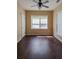 Sun-filled bedroom with hardwood floors, ceiling fan, closet and windows at 743 Pecan Knoll Dr # 5, Marietta, GA 30008