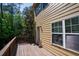 Exterior image of a wooden deck with wood railings showing house siding and windows, and surrounding trees at 743 Pecan Knoll Dr # 5, Marietta, GA 30008