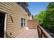 Exterior image of a wooden deck with railings and a view of surrounding trees and the house's siding at 743 Pecan Knoll Dr # 5, Marietta, GA 30008