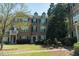 Charming brick townhouse with lush landscaping, dark shutters and a inviting front entrance at 743 Pecan Knoll Dr # 5, Marietta, GA 30008