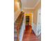Hallway staircase featuring hardwood flooring, white trim and wood and iron railings at 743 Pecan Knoll Dr # 5, Marietta, GA 30008