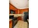 Kitchen featuring granite counters, dark cabinets, tiled floors and stainless-steel appliances at 743 Pecan Knoll Dr # 5, Marietta, GA 30008
