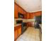 Kitchen showing granite countertops, tile backsplash, and dark cabinets with black appliances at 743 Pecan Knoll Dr # 5, Marietta, GA 30008