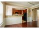 Spacious living room showing the open layout into the kitchen, hardwood floors and neutral paint at 743 Pecan Knoll Dr # 5, Marietta, GA 30008