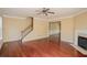 Spacious living room featuring hardwood floors, a fireplace and a staircase at 743 Pecan Knoll Dr # 5, Marietta, GA 30008