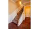 Hallway staircase featuring hardwood flooring and wood and iron railings at 743 Pecan Knoll Dr # 5, Marietta, GA 30008
