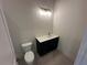 Cozy powder room with vanity, toilet and updated fixtures at 123 Beardon Circle # 159, Atlanta, GA 30316