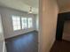 Bright bedroom with dark floors, ceiling fan, and large windows providing natural light at 123 Beardon Circle # 159, Atlanta, GA 30316
