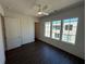 Cozy bedroom featuring hardwood floors, neutral walls and three windows for plenty of light at 123 Beardon Circle # 159, Atlanta, GA 30316