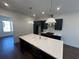 Modern kitchen featuring an island, pendant lights, and stainless steel appliances at 123 Beardon Circle # 159, Atlanta, GA 30316