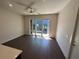 Living room featuring large windows that open to a balcony with exterior views at 123 Beardon Circle # 159, Atlanta, GA 30316