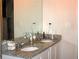 Bathroom featuring granite countertops, a double vanity, and a large mirror at 23 Oxford Ln, Kingston, GA 30145